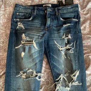 Distressed dark blue boyfriend jeans